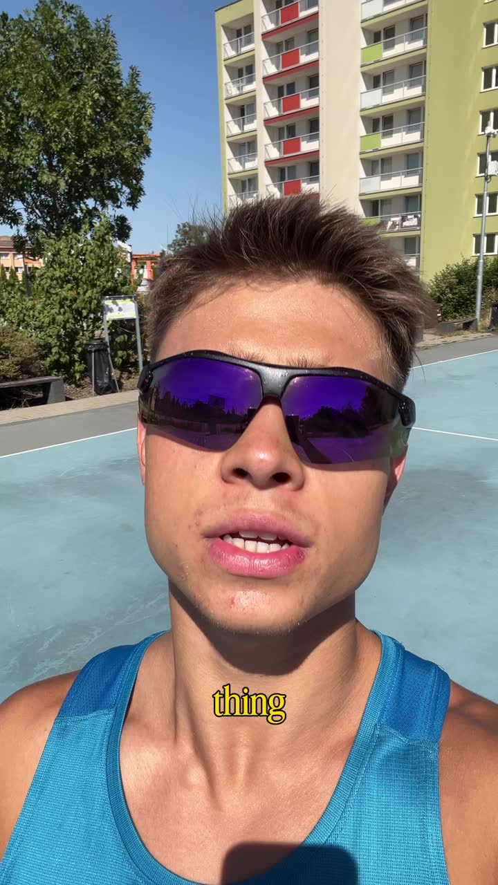 Alex on an outdoor basketball court in sunglasses, talking to camera mid-session