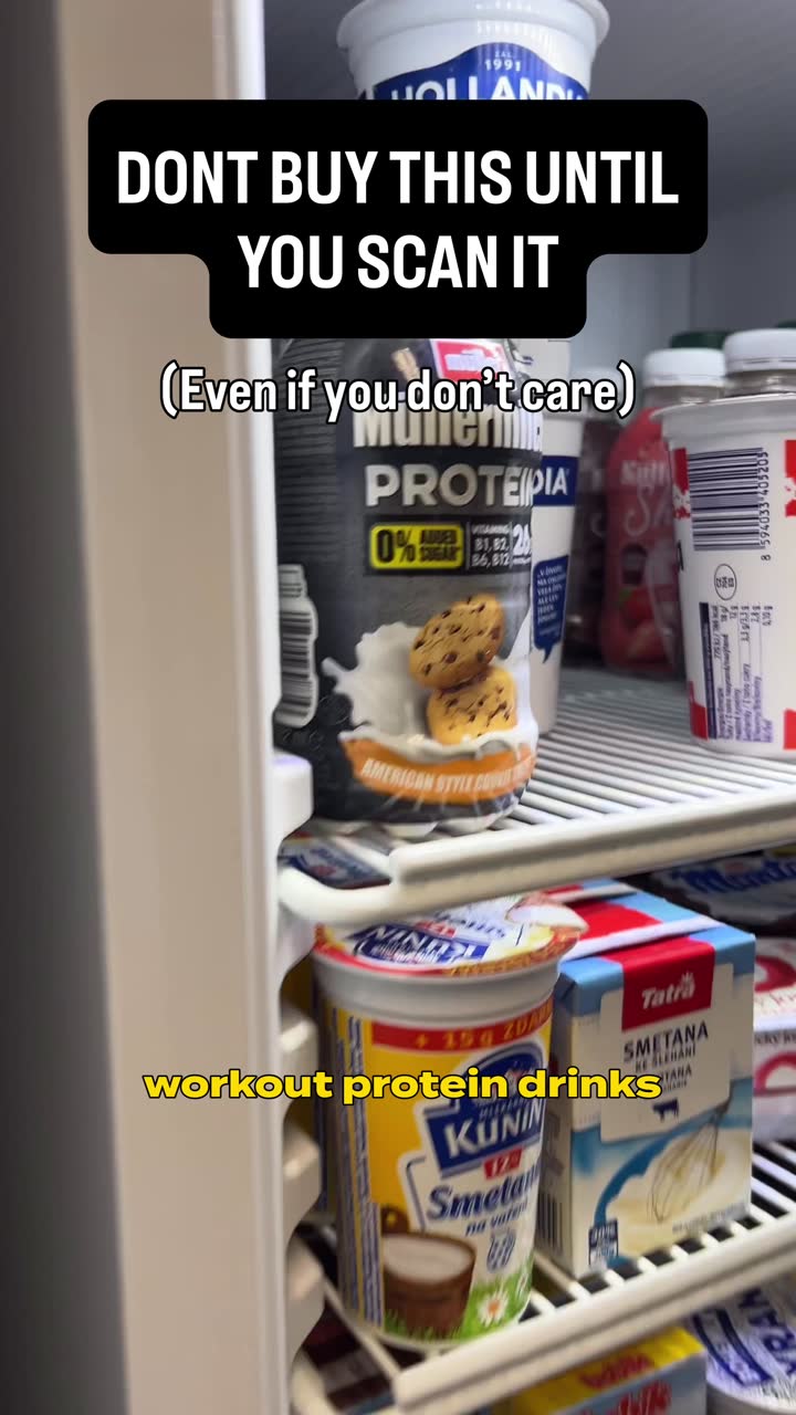POV shot in a supermarket fridge aisle holding a protein drink, hook text reading: Don't buy this until you scan it
